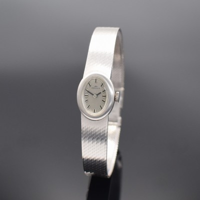 MONDIA Damenarmbanduhr in WG 585/000, Schweiz um 1970, Handaufzug, Boden aufgedr., silb. Zifferbl. m. aufgel. Std.-Ind., schwarze Zeiger, verg. Werk ...