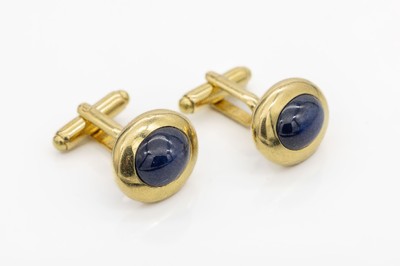 Paar 18 kt gold Saphir-Manschettenknöpfe, GG 750/000, massive Ausführung, Meistermarke unged., 2 Saphir-Cabochons zus. ca. 12.0 ct, total ca. 19.2 ...
