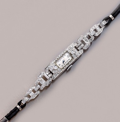 Art-Deco Schmuckbanduhr mit Diamanten, um 1940, Platin, reicher Diamantbesatz zus. ca. 3.0 ct get.Weiß/si-p, zeittyp., Handaufzug, cremefarb. ...