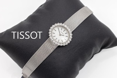 14 kt Gold Tissot Damenschmuckuhr, WG 585/000, 25 Brillanten zus. ca. 1.0 ct Weiß/si, Handaufzug, L. ca. 15.5 bzw. 16 cm, total ca. 29.2 g