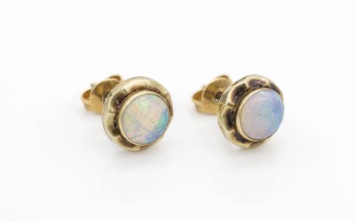 Paar 14 kt Gold Opal-Ohrstecker, GG 585/000, 2 Opale zus. ca. 0.60 ct, D. ca. 8 mmmit Fassung