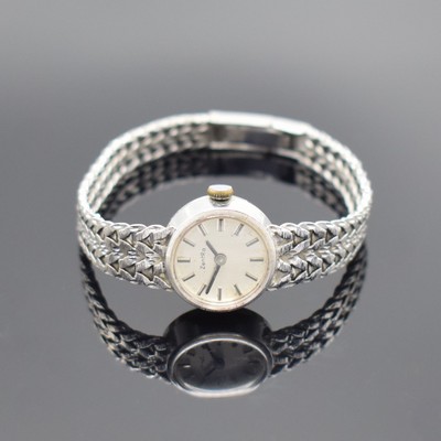 ZENTRA Damenarmbanduhr in WG 585/000, Deutschland um 1970, quarz, 2-teil. Gehäuse, Boden aufgedr., silb. Zifferbl. m. aufges. Std.-Ind. fl., D. ca. ...