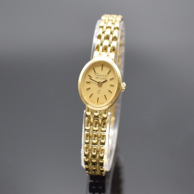 DE LUXE Quartz Damenarmbanduhr in GG 333/000, Schweiz um 2000, Geh. an Goldband 333/000, Boden aufgedr., champagnerfarb. Zifferbl. m. gold. ...