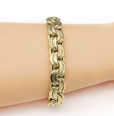 14 kt Gold Armband, GG 585/000, ineinander verschlungene Glieder, L. ca. 20 cm, Kastenschloss mit 2 Sicherheitsachten, ca. 44.5 g