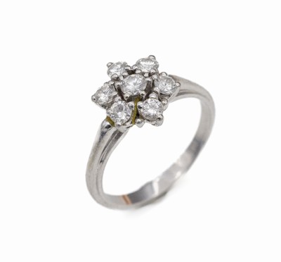 14 kt Gold Brillant-Ring, WG 585/000, blütenförmiger Ringkopf, 7 Brillanten zus. ca.0.65 ct feines Weiß-Weiß/vs, RW 53, ca. 3.2 g