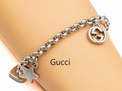 GUCCI Bettelarmband, Silber geprüft, 3 Abhängungen, L. ca. 20 cm, Karabinerschließe, ca. 32.1 g