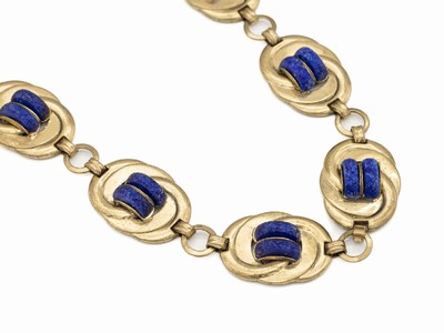 Art-Deco Collier um 1925/30, Metall vergoldet, ovale Glieder mit stil. Knotenmotiv, aufgel. lapislazulifarb. Kunststoffringe, ausgefallen, L. ca. 44 ...