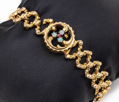 8 kt Gold Opal-Scherenarmband, wohl England um1890/1900, GG 333/000, rundes Mittelteil besetzt mit 3 Opalcabochons und roten Farbstein, D. max. 7.0 ...