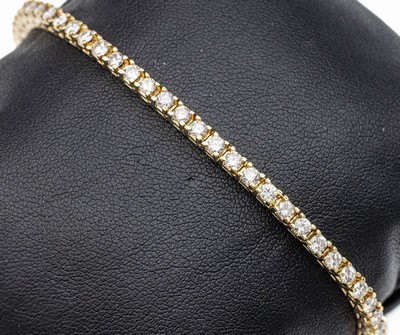 14 kt Gold Brillant-Linienarmband, GG 585/000, 52 Brillanten zus. ca. 3.30 ct Weiß/si, L. ca. 17.5 cm, ca. 13 g, Kastenschloß mit Sicherheitsacht