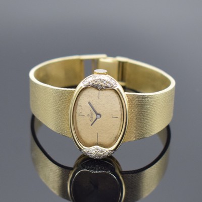 EXQUISIT Damenarmbanduhr in GG 585/000, Schweiz um 1970, quarz, m. Diamanten bes., Boden aufgedr., gold. Zifferbl. m. schwarzen Zeigern, M. ca. 30 x ...