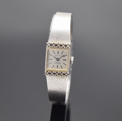 IMPERIA Damenarmbanduhr in WG 585/000, Schweiz verk. lt. beil. Garantieschein 10/1974, Handaufzug, Boden aufgedr., Anstöße m. Diamanten bes., silb. ...
