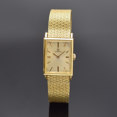 OMEGA Armbanduhr in GG 750/000, Schweiz um 1965, Handaufzug, Boden aufgedr., silb. Zifferbl. m. aufgel. gold. Std.-Ind. und Zeigern pat., rotverg. ...