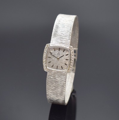 EBEL Damenarmbanduhr in WG 750/000, Handaufzug, Schweiz um 1965, Lünette seitl. m. Diamanten bes., Boden aufgedr., Milanaiseband, Strukturzifferbl. ...