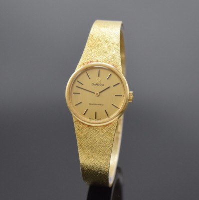 OMEGA Damenarmbanduhr in GG 585/000, Schweiz um 1973, Automatik, Boden aufgedr., champagnerfarb. Zifferbl. m. aufgel. Std.- Ind., schwarze Zeiger, ...