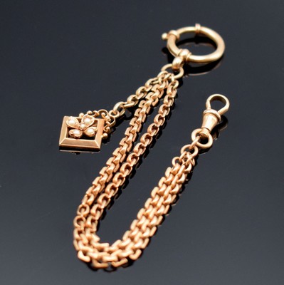 Taschenuhrkette in RG 585/000, mit Karabiner, Federring und Anhänger in Form einer Blüte m. kleinen Perlen, L. ca. 18 cm, Gew. ca. 13g, in ...