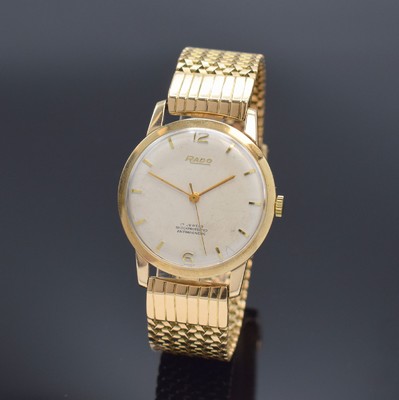 RADO Herrenarmbanduhr in RG 585/000 an RG 750/000 Band, Handaufzug, Schweiz um 1960, einschaliges Geh., Glasrand aufgedr., silb. Zifferbl. m. aufgel. ...