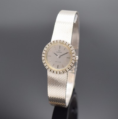 OMEGA De Ville Damenarmbanduhr in WG 750/000 mit Diamanten, Schweiz um 1970, Handaufzug, 2-teil. Geh., Boden aufgedr., Lünette mit Diamanten bes., ...