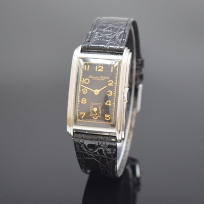 IWC rechteckige Herrenarmbanduhr mit Kaliber 87 in Stahl, Schweiz um 1937, Handaufzug, 2-teil. gestuft. Geh., Boden aufgedr., schwarzes Zifferbl. m. ...