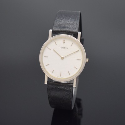 CORUM Armbanduhr in Platin, Schweiz um 1985, quarz, Boden 6-fach verschr., orig. Lederband m. orig. Dornschl., silb. Zifferbl. m. silb. Std.-Ind. und ...