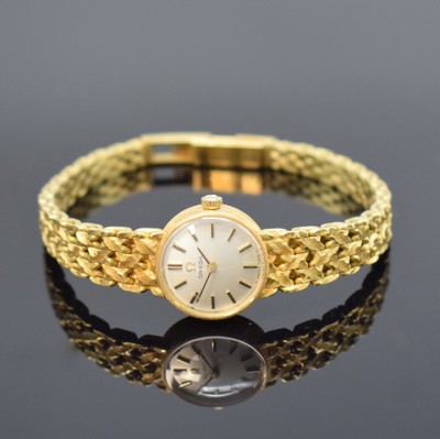 OMEGA Damenarmbanduhr in GG 750/000 Referenz 1211, Schweiz um 1968, Handaufzug, 2-teil. Geh., Boden aufgedr., Kettenglieder-Band, silb. Zifferbl. m. ...
