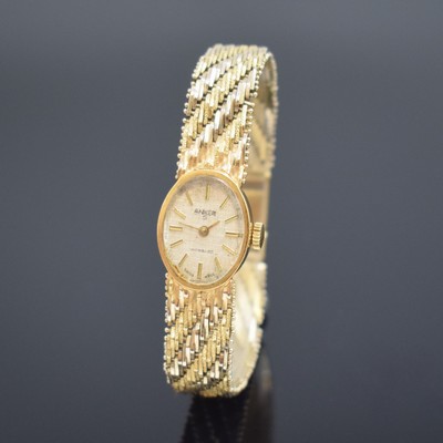 ANKER Damenarmbanduhr in GG 585/000, Schweiz um 1975, Handaufzug, Boden aufgedr., silb. strukt. Zifferbl. altersbed. fl., aufges. gold. Std.-Ind., ...