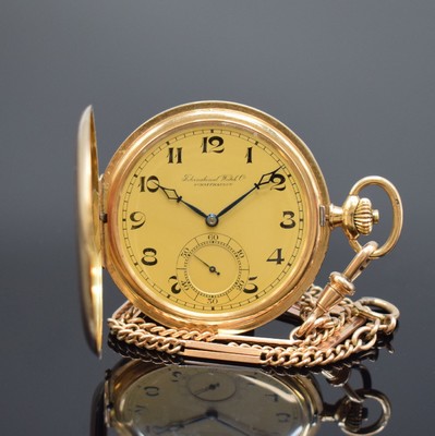 IWC Savonette in RG 585/000 mit vergoldeter Kette, Schweiz um 1925, glattes 3 Deckel- Goldgeh., champagnerfarb. Zifferbl. m. arab. Zahlen, gebl. ...