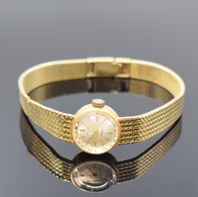 WAGNER Damenarmbanduhr in GG 585/000, Schweiz um 1970, Handaufzug, Boden aufgedr., facett. Glas, silb. Zifferbl. m. gold. Ind. u. Zeigern, Ankerwerk, ...