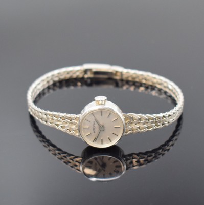BERGANA Damenarmbanduhr in WG 585/000, Schweiz um 1975, Handaufzug, Boden aufgedr., silb. Zifferbl. m. aufges. Std.-Ind., silb. Zeiger, Kal. AS 1977, ...