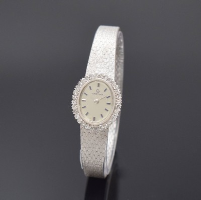 CERTINA diamantbesetzte Damenarmbanduhr in WG 750/000, Schweiz um 1970, Handaufzug, gedr. Geh., integr. orig. Band, silb. Zifferbl., aufges. silb. ...