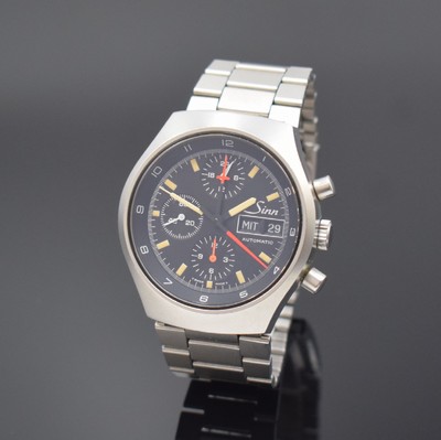 SINN Herrenarmbanduhr mit Chronograph, Schweiz/Deutschland um 1990, Automatik, verschr. Edelstahlgeh., unsign. Gliederband m. Faltschl., schwarzes ...