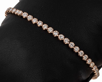 14 kt Gold Brillant-Linienarmband, RG 585/000, 46 Brillanten zus. ca. 4.06 ct (grav.) feines Weiß-Weiß/vs-si, L. ca. 17.5 cm, Kastenschloss mit 2 ...