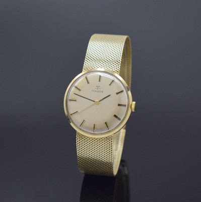 TISSOT Herrenarmbanduhr in GG 585/000, Schweiz um 1970, Handaufzug, 2-teil. Gehäuse, Boden aufgedr., Milanaiseband, silb. Zifferbl. m. aufges. ...