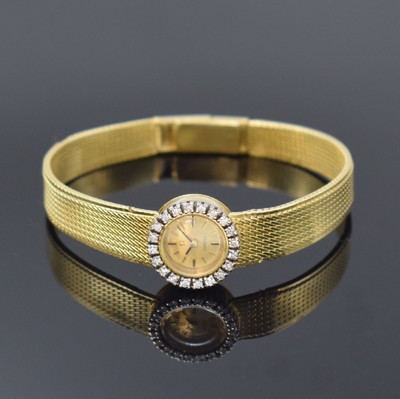 OMEGA sog. "Back Winder" Damenarmbanduhr in GG 750/000, Schweiz um 1963, Handaufzug, 2- teil. Gehäuse, Boden aufgedr., Krone im Geh.- ...