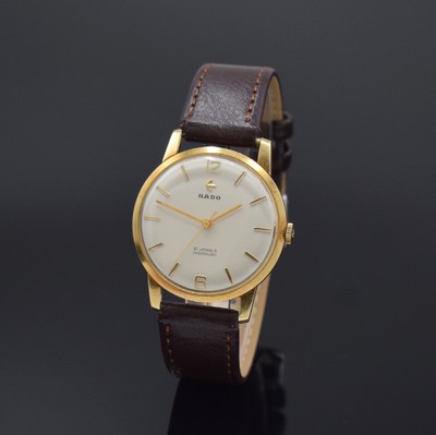 RADO Herrenarmbanduhr in GG 585/000 Referenz 10584B, Schweiz um 1960, Handaufzug, Glasrand aufgedr., silb. Zifferbl. m. gold. Std.-Ind., gold. ...