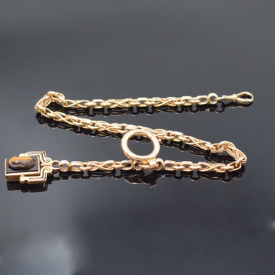 Taschenuhrkette in RG 585/000 mit Petschaft,um 1900, Karabiner und Federring, Petschaft- Anhänger mit Lagenstein, darauf plastisch gearbeiteter Kopf ...