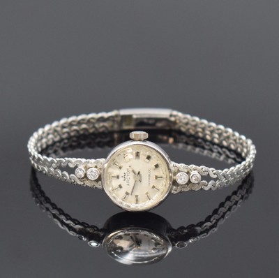 Damen Schmuckuhr in WG 585/000 bezeichnet Arctos, Deutschland um 1970, auf quarz umgerüstet, Boden aufgedr., Band zum Geh. m. 4 Diamanten bes., Anz. ...
