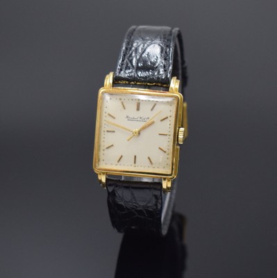 IWC viereckige Armbanduhr in GG 750/000, Schweiz um 1957, Handaufzug, aufgedr. Boden l. dell., rest. silb. Zifferbl. fl., gold. Std.-Ind., gold. ...