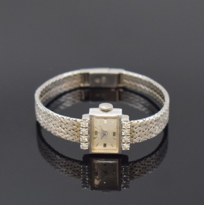 EBEL Damenarmbanduhr in WG 750/000 mit Diamanten, Schweiz um 1965, Handaufzug, 2- teil. Geh., Boden aufgedr., silb. Zifferbl. m. aufges. Std.-Ind. ...