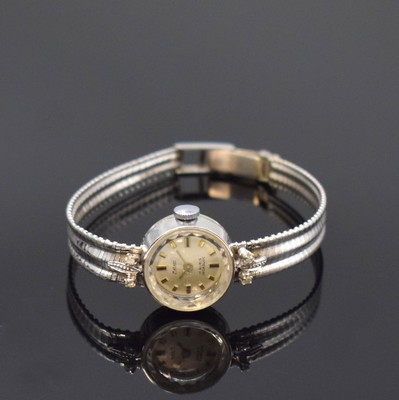 METEOR Diamantbesetzte Damenarmbanduhr in WG 750/000, Schweiz um 1960, Handaufzug, 2- teil. Geh. m. aufgedr. Boden, anges. Band, silb. Zifferbl., ...