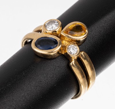 18 kt Gold Farbstein-Brillant-Ring, GG 750/000, gelber Saphir-Tropfen und blauer ovalfacett. Saphir zus. ca. 0.60 ct, 2 Brillanten zus. ca. 0.35 ct ...