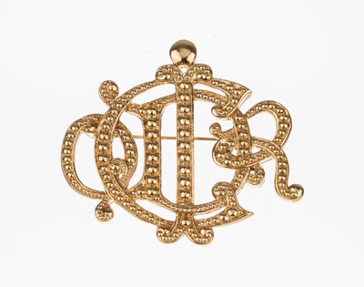 CHRISTIAN DIOR Brosche, 1980er Jahre Metall verg., ligierter Schriftzug, mit erhabenem Dekor, Anlehnung an eine Gürtelschnalle, sign., ca. 5.5 x ...
