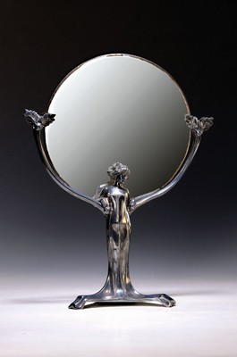 Tisch-Spiegel, Frankreich, um 1900, Metall, in Form einer vollplastischen Frauenfigur, rundes facett. Spiegelglas, Altersspuren, H. ca. 42cm