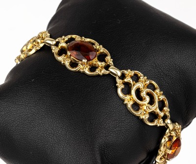 14 kt Gold Citrin-Armband, GG 585/000, 1950er Jahre, geschwungene Glieder, 3 ovalfacett. Citrine, L. ca. 18 cm, Klappverschluss, ca. 15.1 g