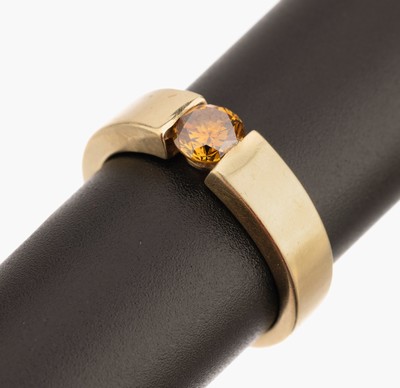 14 kt Gold Brillant-Ring, GG 585/000, Brillant ca. 0.75 ct (wohl beh.,) fancy orangyyellowish, in Spannringoptik, RW 60, ca. 10 g