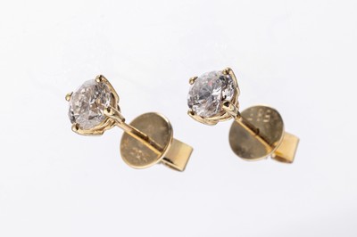 Paar 14 kt Gold Brillant-Ohrstecker, GG 585/000, 2 Brillanten zus. ca. 1.18 ct Weiß-l.get.Weiß/p1