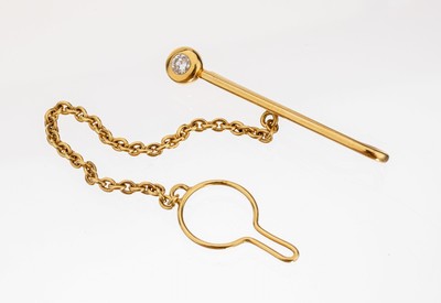 18 kt Gold Brillant-Krawattenklammer, GG 750/000, schlichte Gestaltung, 1 Brillant ca. 0.20 ct feines Weiß/vs, L. ca. 4.2 cm, mit ...