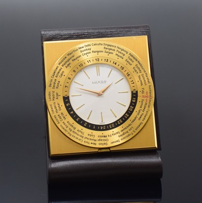 LUXOR Reiseuhr mit Weltzeitanzeige, Schweiz um 1965, Handaufzug, rechteck., verg. Geh., eingeschraubt in Lederetui, beids. drehb. Weltzeit-Lünette ...