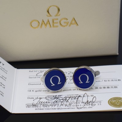 OMEGA Manschettenknöpfe in Edelstahl mit original Etui und Zertifikat, verk. lt. beil. Zertifikat 06/2024, blauer Lack, Kippverschluss, M. ca. 20 x ...
