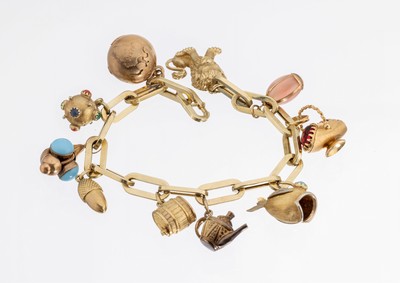 14 kt Gold Armband mit Anhängern, GG 585/000 gepr., länglich ovale Glieder, 10 bewegl. Abhängungen 1 x Weltkugel GG 585/000, 1 x Kugel mit ...