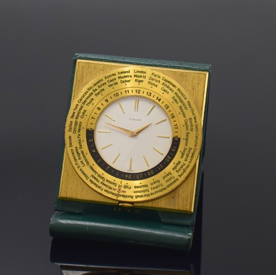TÜRLER Reiseuhr mit Weltzeitanzeige, Schweiz um 1960, Handaufzug, verg. Gehäuse im Lederetui, drehbare Lünette m. Weltstädten und 24-Std.-Skala, ...